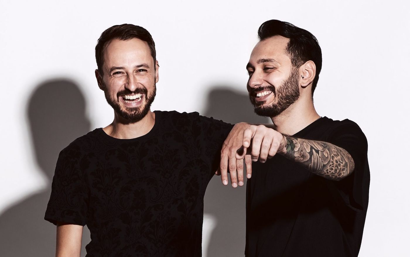 YėY — the two members of the live act laughing together