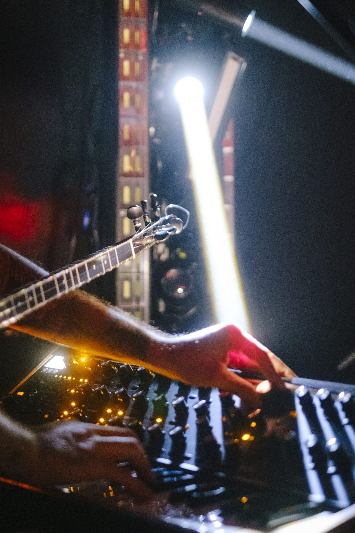 Close-up of hands working the mixer during a live set